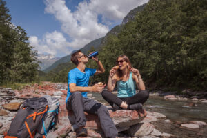 Couple taking a lunch break out in nature