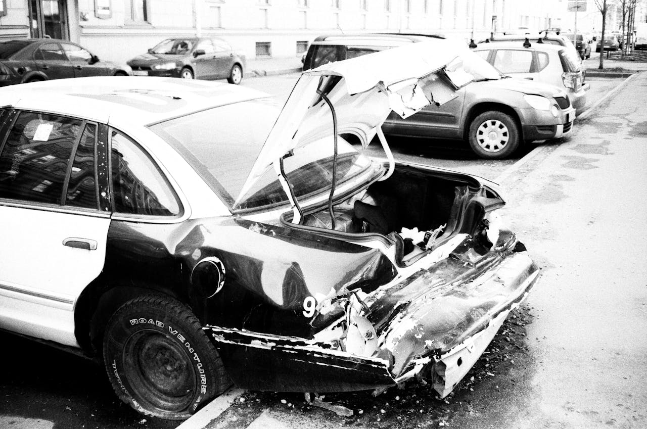 Photo by Aleksandr Neplokhov: https://www.pexels.com/photo/grayscale-photo-of-wrecked-car-parked-outside-1230677/