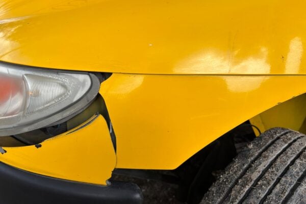 Photo by Jorge Romero: https://www.pexels.com/photo/close-up-of-damaged-yellow-car-front-bumper-33749906/