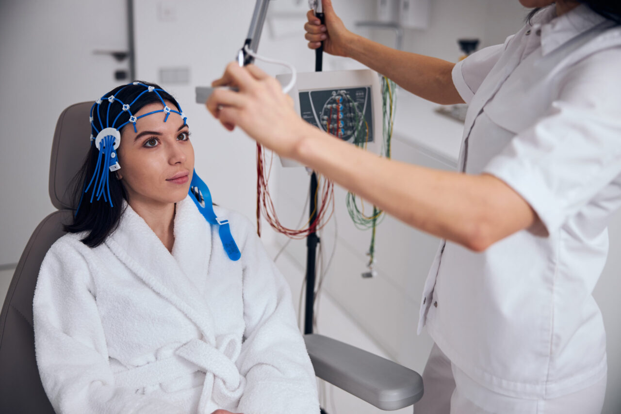 Serene patient seated in the chair before a neurological diagnostics medical procedure
