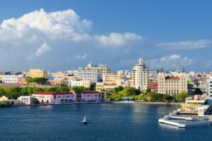 Coastal landscape picture of Puerto Rico with city and blue water