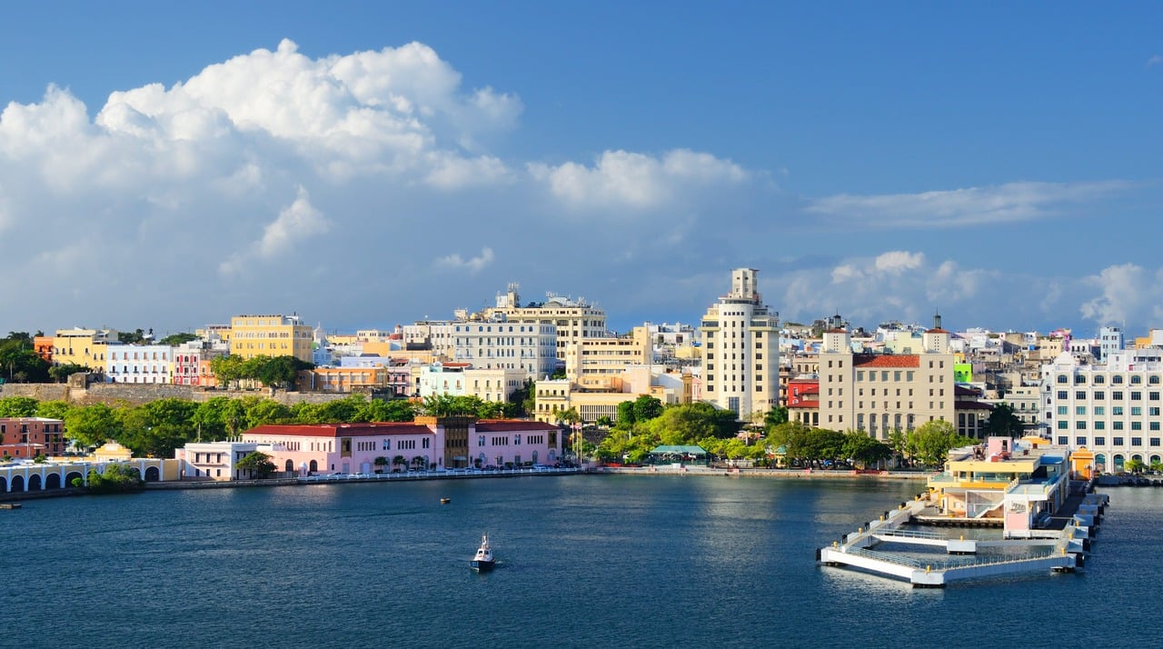 Coastal landscape picture of Puerto Rico with city and blue water