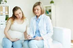 A preganant women with a consultant.
