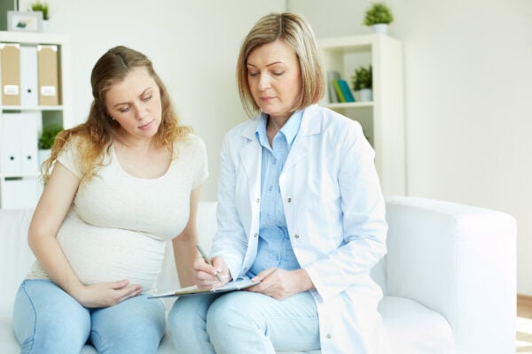 A preganant women with a consultant.